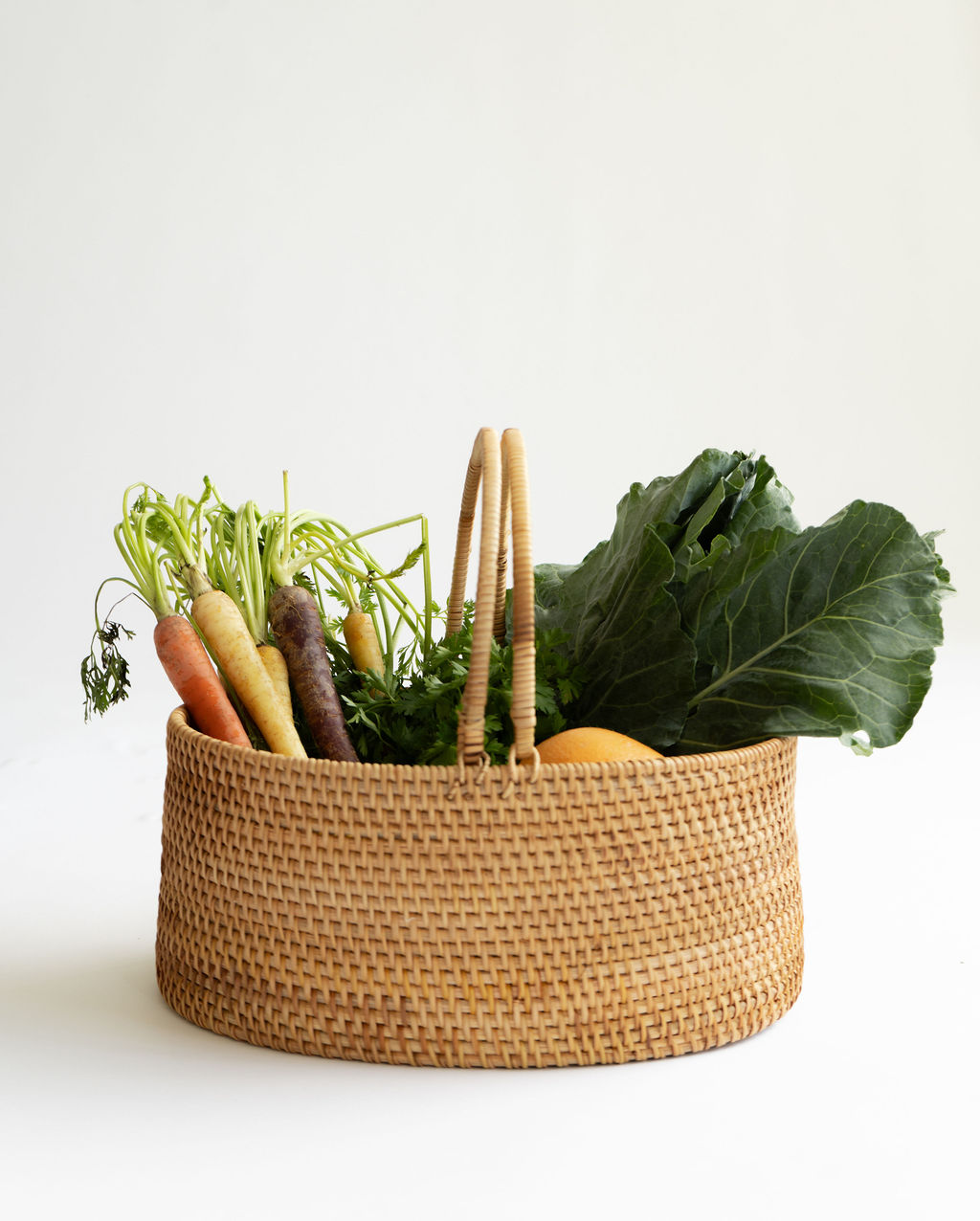 Fresh vegetables in a wicker basket.