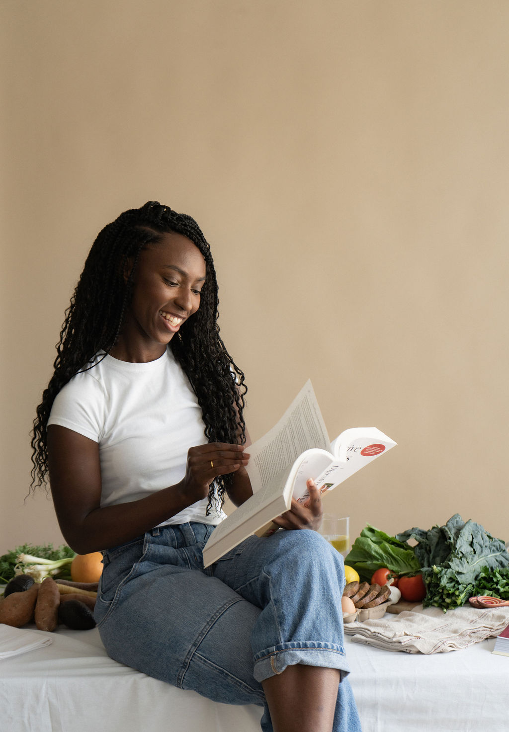 Founder, Miriam Wood with a digestive health book in hand 
